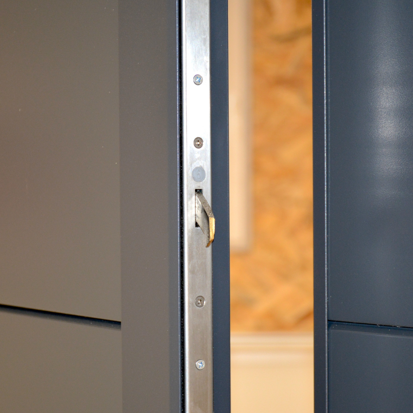 Serrure 3 points dans le portillon